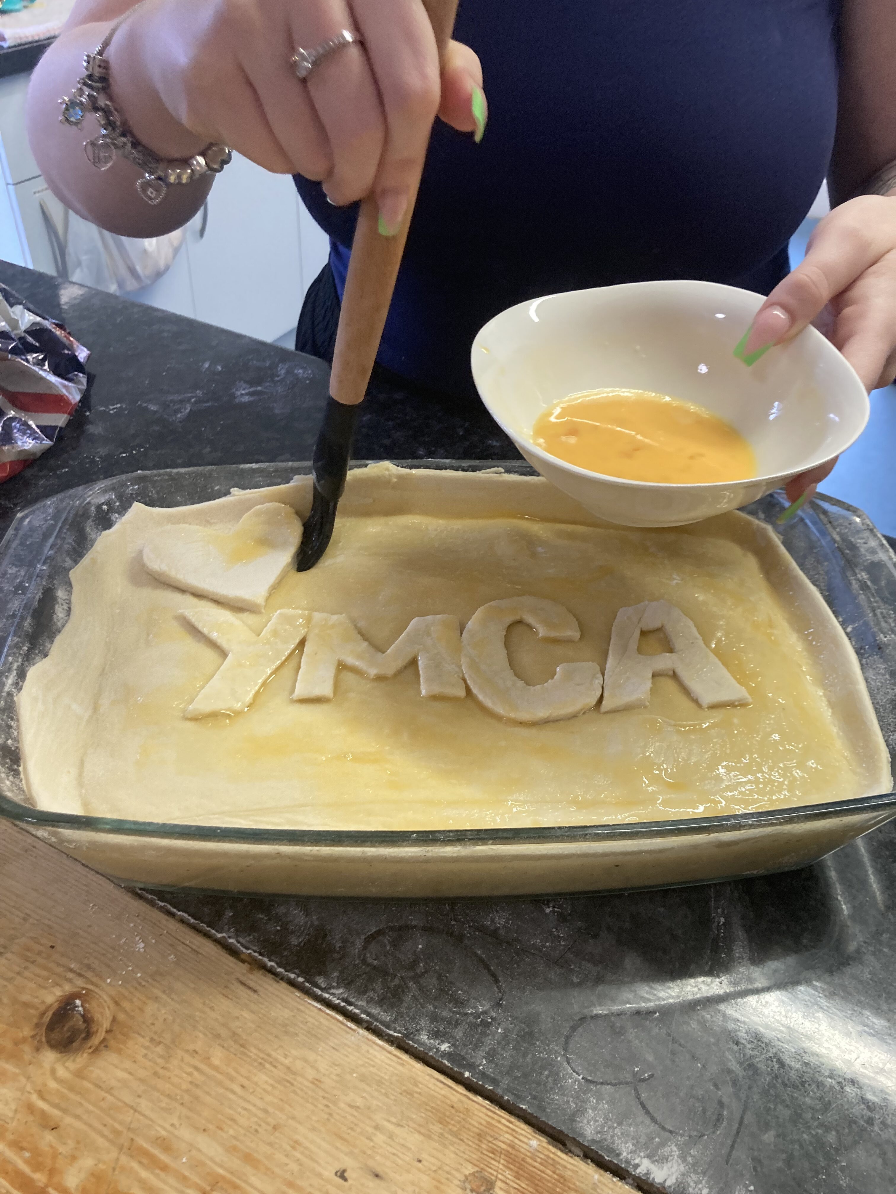 Support worker talking with a young parent