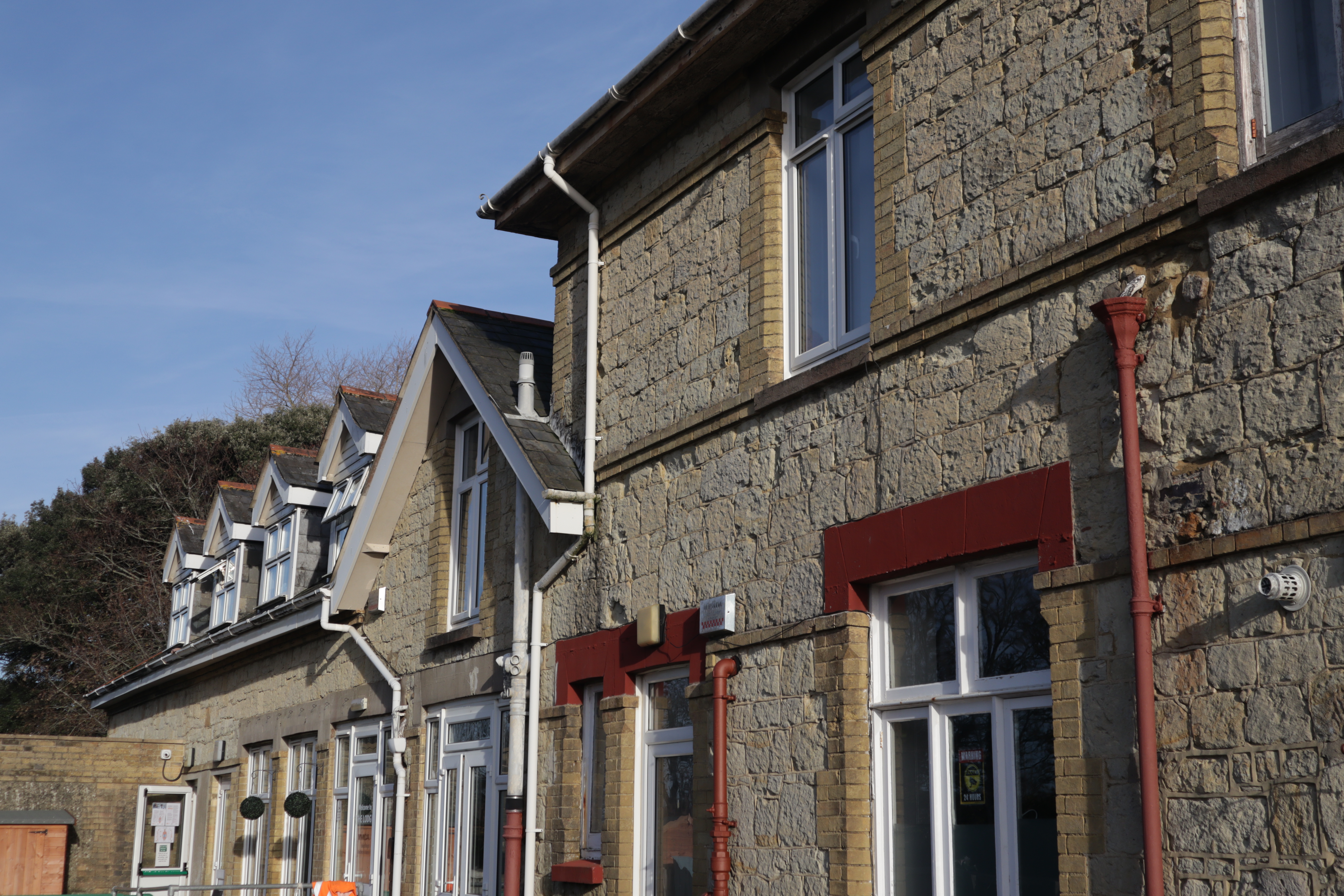 Young mum and baby taking part in a support session at The Lodge