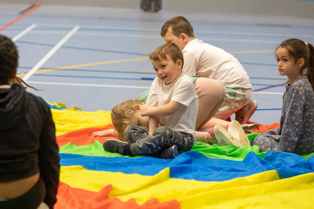 Children playing paracute games