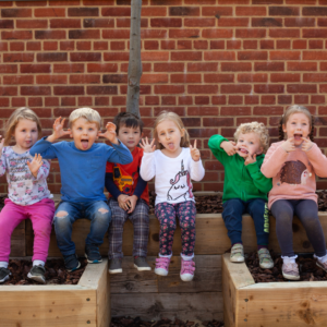 six children at Woolston nursery pulling faces at the camera