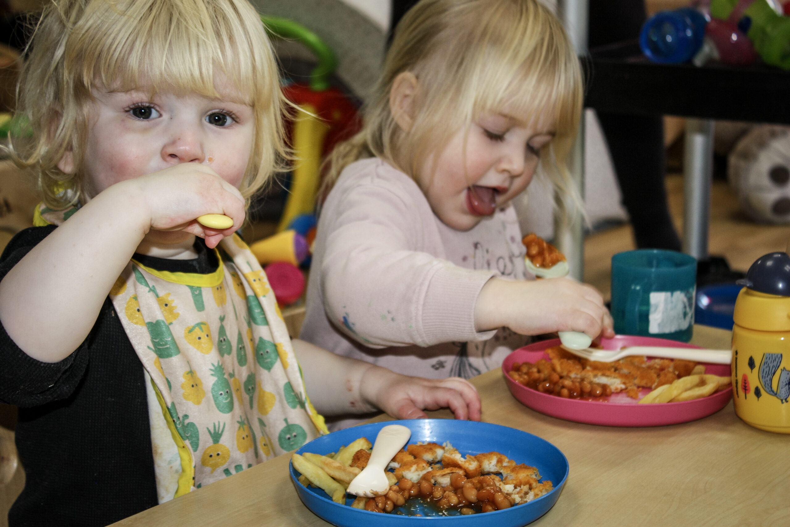 Children enjoying freshly prepared lunch at nursery