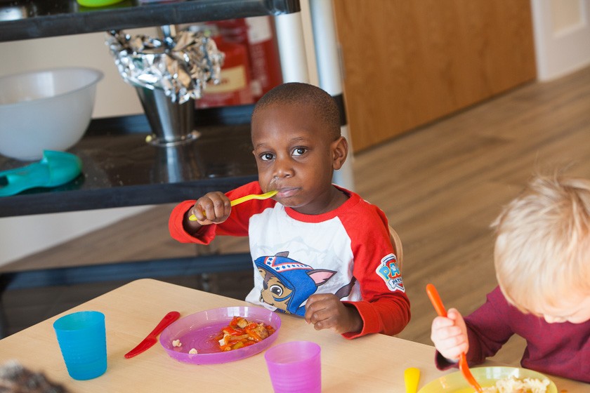 Children enjoying freshly prepared lunch at nursery